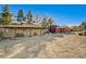 Several rustic buildings, including a bunkhouse and barns, on a desert property at 5353 Dorrell Ln, Las Vegas, NV 89131