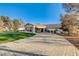 Front view of a single-story home with large driveway at 5353 Dorrell Ln, Las Vegas, NV 89131