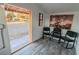 Small office or seating area featuring three black chairs, wood-look flooring, and horse-themed artwork at 5353 Dorrell Ln, Las Vegas, NV 89131