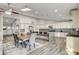 Spacious kitchen boasting an island, white cabinets, and granite counters at 5353 Dorrell Ln, Las Vegas, NV 89131