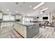 Spacious kitchen boasts modern island, ample cabinetry, and high-end finishes at 5353 Dorrell Ln, Las Vegas, NV 89131