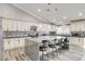 Updated kitchen with white cabinets, an island, and stylish backsplash at 5353 Dorrell Ln, Las Vegas, NV 89131