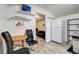 Small kitchenette with a table and chairs, and view into living room at 5353 Dorrell Ln, Las Vegas, NV 89131