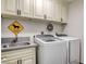 Laundry room with a washer, dryer, and a convenient countertop at 5353 Dorrell Ln, Las Vegas, NV 89131