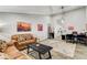 Relaxing living room with leather couches and a view into the kitchen at 5353 Dorrell Ln, Las Vegas, NV 89131