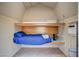 Small loft bedroom with a full-size bed and wood accents at 5353 Dorrell Ln, Las Vegas, NV 89131