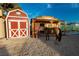 Farmhouse and saloon-style buildings on the property at 5353 Dorrell Ln, Las Vegas, NV 89131