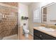 Clean bathroom with shower, toilet and granite countertop at 5455 San Florentine Ave, Las Vegas, NV 89141