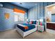 Bedroom with blue walls and orange accents, plus a view at 5455 San Florentine Ave, Las Vegas, NV 89141