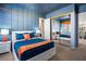 Bright bedroom with a unique blue and orange color scheme at 5455 San Florentine Ave, Las Vegas, NV 89141