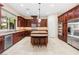 Beautiful kitchen with stainless steel appliances, granite countertops, and a center island with seating at 5455 San Florentine Ave, Las Vegas, NV 89141