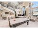 Open living space with high ceilings, pool table, bar, and elegant staircase at 5455 San Florentine Ave, Las Vegas, NV 89141