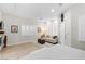 Main bedroom with king-size bed, sitting area, and private door access at 5455 San Florentine Ave, Las Vegas, NV 89141
