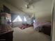 Spacious bedroom with a ceiling fan and carpet at 5697 Crowbush Cove Pl, Las Vegas, NV 89122