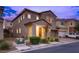 Two-story house with a two-car garage and landscaping at 5835 Rustic Prairie St, Las Vegas, NV 89148