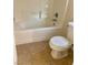 Bathroom with a bathtub, tile flooring and toilet at 5836 Aimless St, Henderson, NV 89011