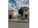 Two story house with attached garage, landscaping, and driveway at 5836 Aimless St, Henderson, NV 89011