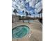 Inviting community pool area, featuring a jacuzzi and several palm trees for a resort-like feel at 5836 Aimless St, Henderson, NV 89011