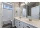 Bathroom with double vanity, mirror, and shower/tub combo at 6010 Garthmore, Las Vegas, NV 89141