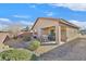 Covered patio, gravel yard, and desert landscaping at 6072 Isola Peak Ave, Las Vegas, NV 89122