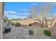 Landscaped backyard with gravel and desert plants at 6072 Isola Peak Ave, Las Vegas, NV 89122