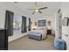 Spacious bedroom with a comfortable bed and large window at 6072 Isola Peak Ave, Las Vegas, NV 89122