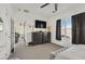 Bright bedroom featuring a TV and ample closet space at 6072 Isola Peak Ave, Las Vegas, NV 89122