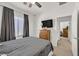 Guest bedroom with full bed and access to another room at 6072 Isola Peak Ave, Las Vegas, NV 89122