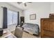 Small bedroom with a daybed and built-in shelving at 6072 Isola Peak Ave, Las Vegas, NV 89122
