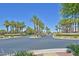 Community entrance with palm trees and signage at 6072 Isola Peak Ave, Las Vegas, NV 89122