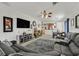 Open living room with sectional sofa and view of dining area at 6072 Isola Peak Ave, Las Vegas, NV 89122