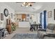 Open living area with sectional sofa, dining table, and kitchen at 6072 Isola Peak Ave, Las Vegas, NV 89122
