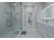 Modern bathroom with a large walk-in shower, double vanity, and LED mirrors at 6788 Lavender Sky Ct, Las Vegas, NV 89142