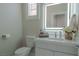 Modern bathroom with updated vanity and a large mirror at 6788 Lavender Sky Ct, Las Vegas, NV 89142