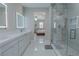 Spa-like bathroom with a glass shower, double vanity, and view of bedroom at 6788 Lavender Sky Ct, Las Vegas, NV 89142