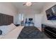 Spacious bedroom with large TV, walk-in closet, and plush bedding at 6788 Lavender Sky Ct, Las Vegas, NV 89142