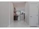 Bright entryway with shiny floors and a view into the kitchen and dining area at 6788 Lavender Sky Ct, Las Vegas, NV 89142
