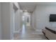 Bright hallway with wood flooring and access to bathroom at 6788 Lavender Sky Ct, Las Vegas, NV 89142