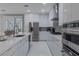 Modern kitchen with white cabinets, stainless steel appliances, and a large island at 6788 Lavender Sky Ct, Las Vegas, NV 89142