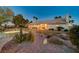 Landscaped backyard with a hot tub and an outdoor entertaining area at 7015 N Jensen St, Las Vegas, NV 89149