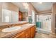 Double vanity bathroom with a walk-in shower at 7015 N Jensen St, Las Vegas, NV 89149