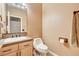 Clean bathroom with updated fixtures and wood vanity at 7015 N Jensen St, Las Vegas, NV 89149