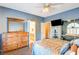 Bedroom with a queen-size bed, dresser, and access to the bathroom at 7015 N Jensen St, Las Vegas, NV 89149