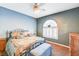 Bedroom with a queen-size bed and an arched window with plantation shutters at 7015 N Jensen St, Las Vegas, NV 89149