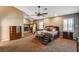 Main bedroom with ceiling fan, fireplace, and walk-in closet at 7015 N Jensen St, Las Vegas, NV 89149