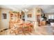 Dining room features a round table with wooden chairs and built-in hutch at 7015 N Jensen St, Las Vegas, NV 89149