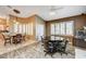 Breakfast nook with a round table and four chairs, near a kitchen at 7015 N Jensen St, Las Vegas, NV 89149