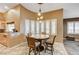 Cozy dining area with bay window and granite top table at 7015 N Jensen St, Las Vegas, NV 89149
