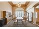 Formal dining room with a large table and hutch at 7015 N Jensen St, Las Vegas, NV 89149