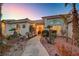 Welcoming entryway with landscaping and lighting at 7015 N Jensen St, Las Vegas, NV 89149